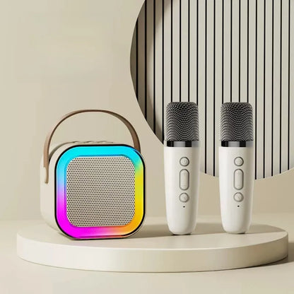 Colorful speaker and two microphones on a neutral background
