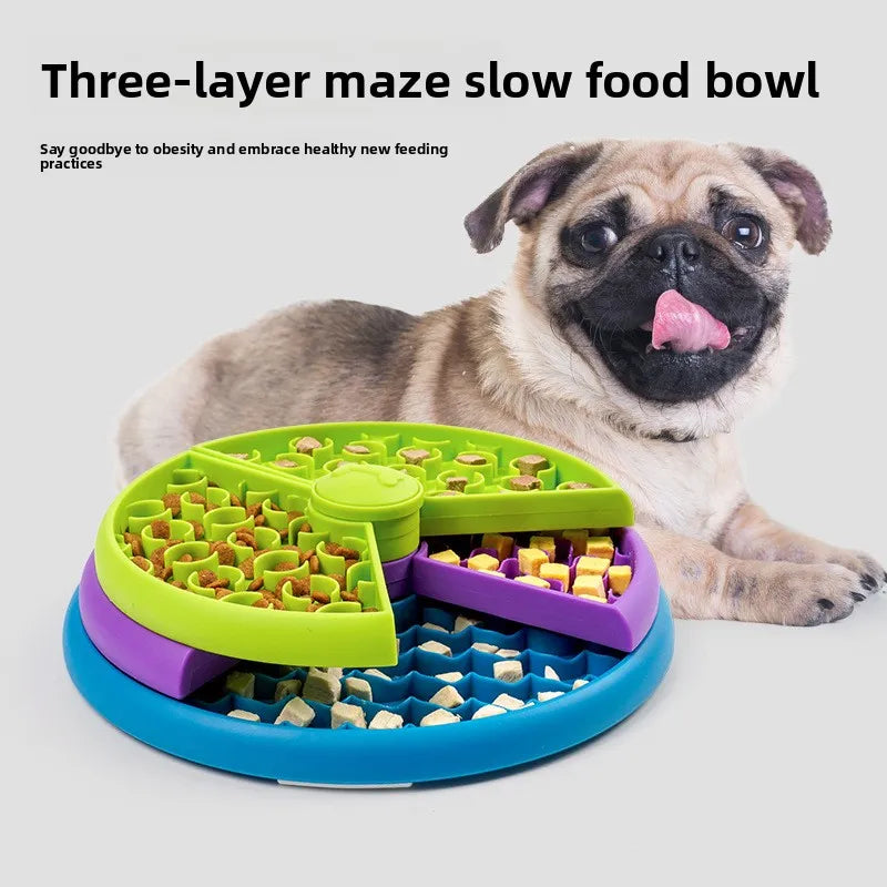 Three-layer maze slow food bowl with a dog next to it on a white background