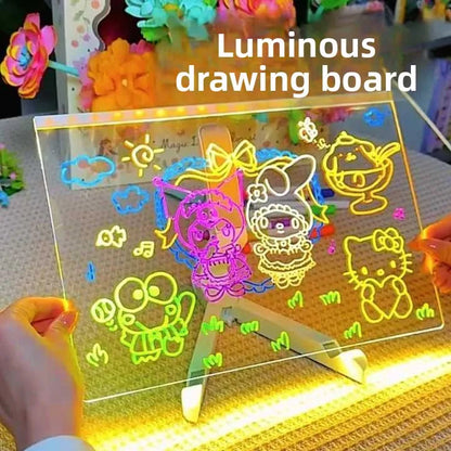 Luminous drawing board with colorful drawings on a table.