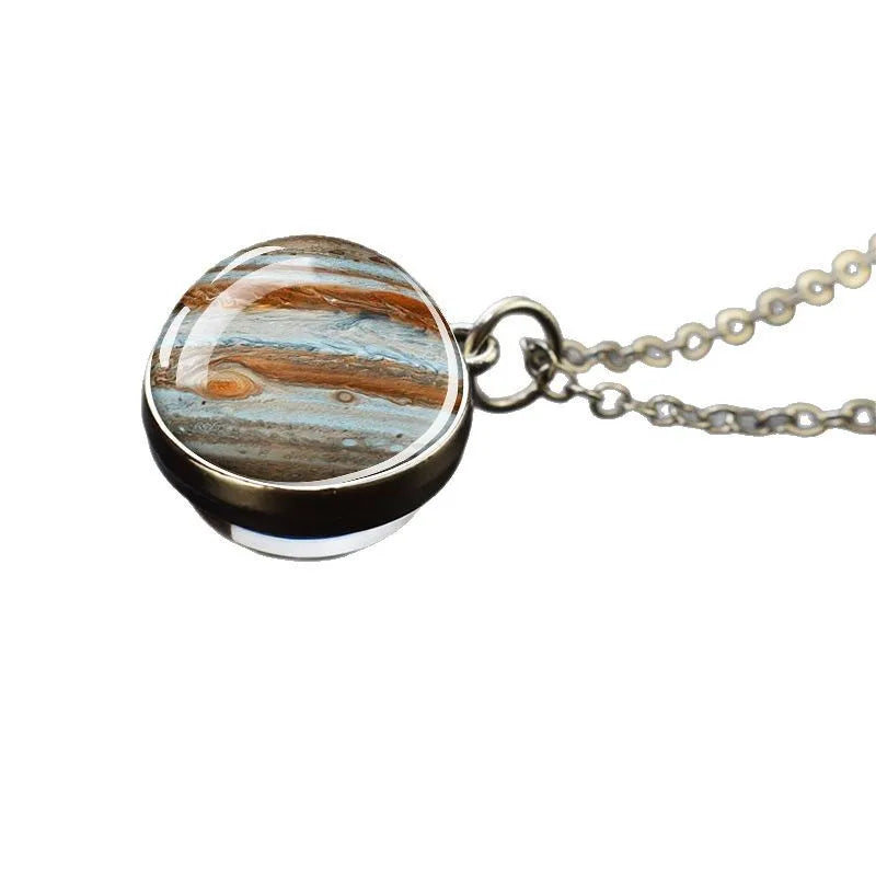 Necklace with a round pendant featuring a pattern resembling Jupiter's surface on a white background
