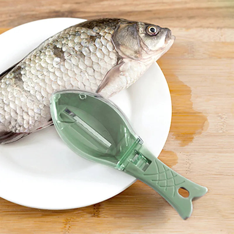 Green fish-shaped tool on a white plate with a whole fish on a wooden surface