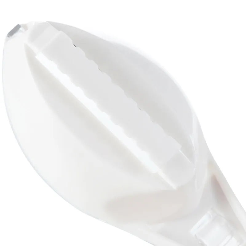 Close-up of a white spoon on a white background